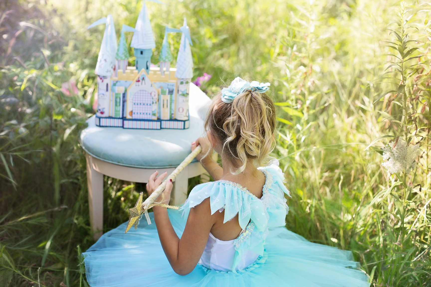 Little Girl Playing with Her Toy Castle