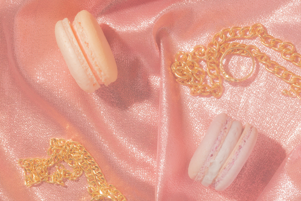 French Macarons with Jewelry on Pink Silk